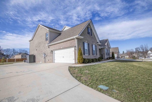 view of home's exterior with a lawn, concrete driveway, brick siding, a residential view, and roof with shingles