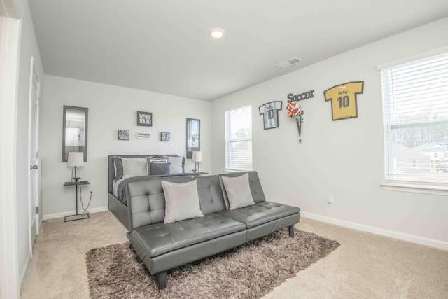 bedroom featuring light carpet, recessed lighting, visible vents, and baseboards