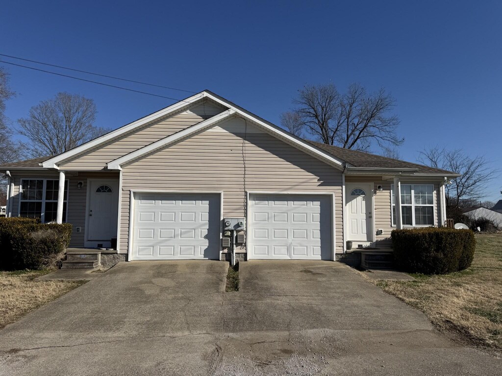 163 W Oak St, Trenton, KY 42286 - ranch-style house with an attached garage and driveway
