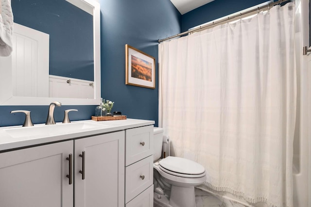 full bath with toilet, marble finish floor, a shower with shower curtain, and vanity