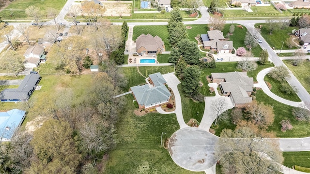 birds eye view of property with a residential view