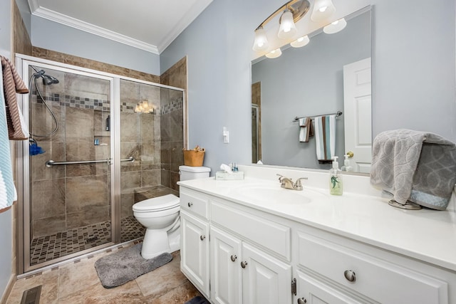 bathroom with visible vents, toilet, crown molding, vanity, and a stall shower