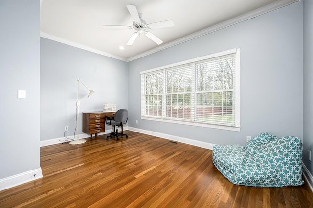 office featuring ceiling fan, baseboards, crown molding, and wood finished floors