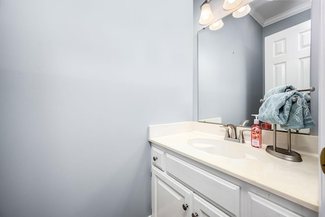 bathroom with crown molding and vanity