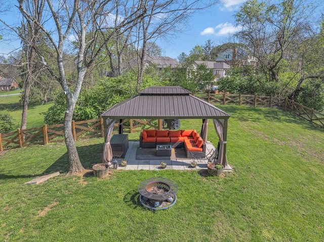 view of yard featuring a patio area, a gazebo, a fenced backyard, and an outdoor fire pit