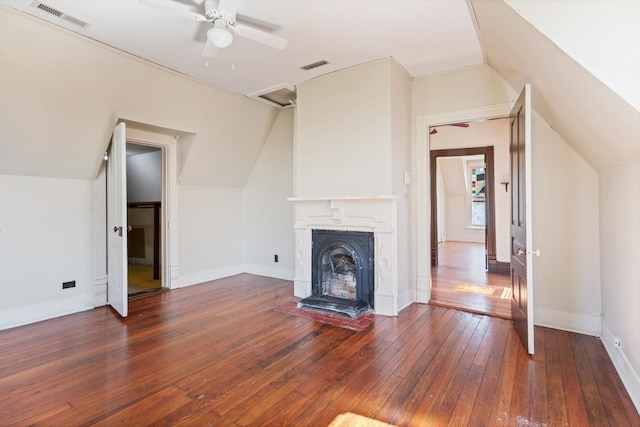 201 Knob Creek Rd, Wartrace, TN 37183 - unfurnished living room with wood-type flooring, visible vents, lofted ceiling, and a fireplace