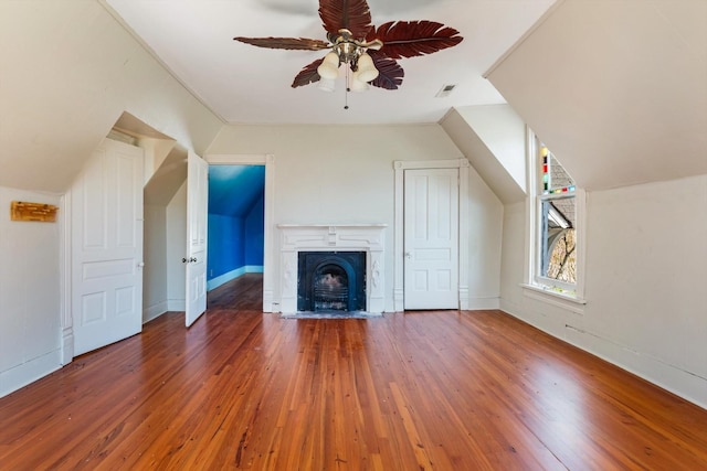 201 Knob Creek Rd, Wartrace, TN 37183 - bonus room featuring visible vents, wood-type flooring, vaulted ceiling, a fireplace, and a ceiling fan