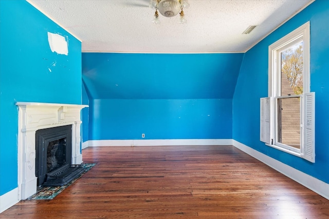 201 Knob Creek Rd, Wartrace, TN 37183 - bonus room with a fireplace with flush hearth, a textured ceiling, visible vents, vaulted ceiling, and wood finished floors