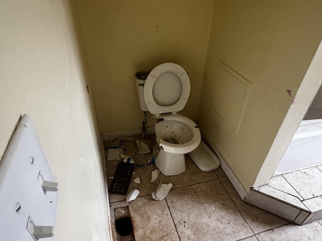 bathroom with tile patterned floors and toilet