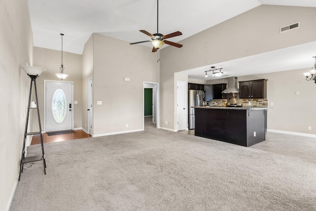 1995 General Neyland Dr, Clarksville, TN 37042 - unfurnished living room featuring high vaulted ceiling, visible vents, light carpet, and baseboards