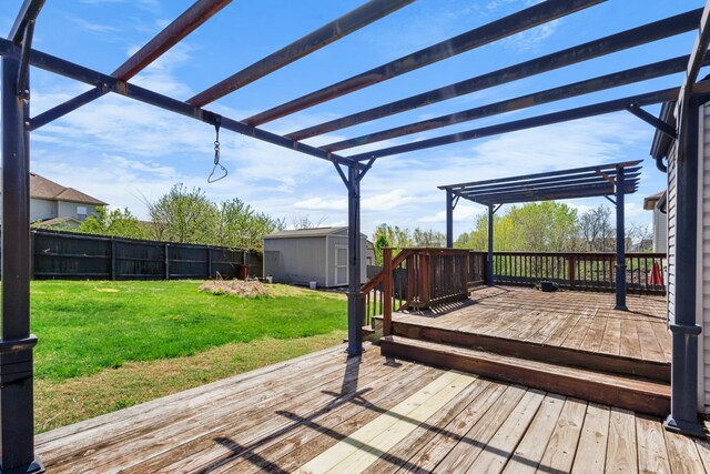 1995 General Neyland Dr, Clarksville, TN 37042 - wooden deck with a pergola, a storage shed, a lawn, a fenced backyard, and an outdoor structure
