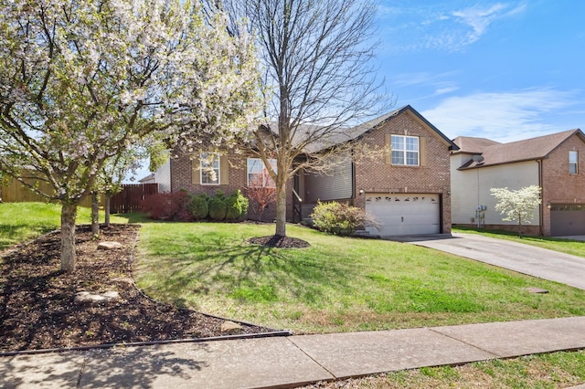 1995 General Neyland Dr, Clarksville, TN 37042 - view of front of home featuring a garage, a front yard, brick siding, and driveway