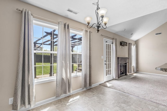 1995 General Neyland Dr, Clarksville, TN 37042 - unfurnished living room featuring baseboards, a fireplace, a notable chandelier, and visible vents