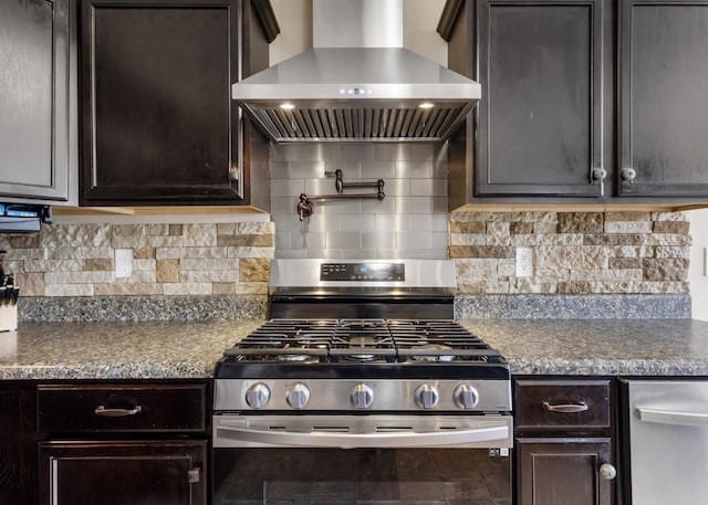 1995 General Neyland Dr, Clarksville, TN 37042 - kitchen with wall chimney exhaust hood, dark countertops, dark brown cabinets, gas stove, and decorative backsplash