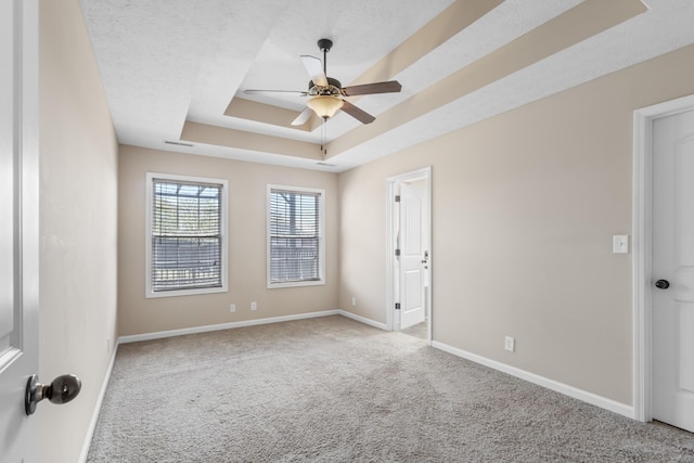 1995 General Neyland Dr, Clarksville, TN 37042 - carpeted spare room with a raised ceiling, ceiling fan, and baseboards