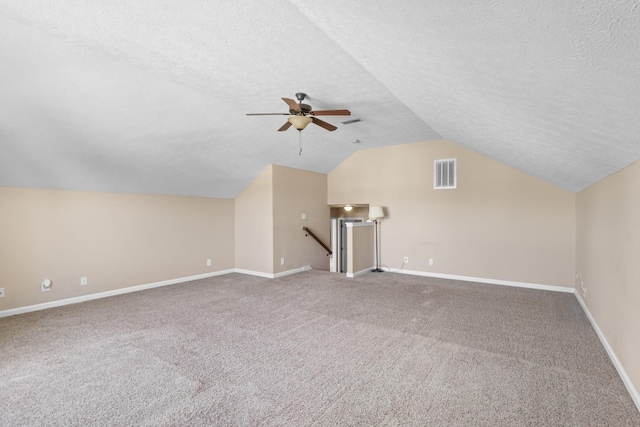 1995 General Neyland Dr, Clarksville, TN 37042 - additional living space with carpet, a textured ceiling, a ceiling fan, vaulted ceiling, and visible vents