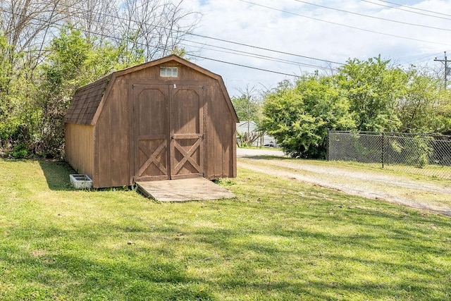 view of shed with fence