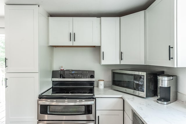 kitchen featuring white cabinets and stainless steel appliances