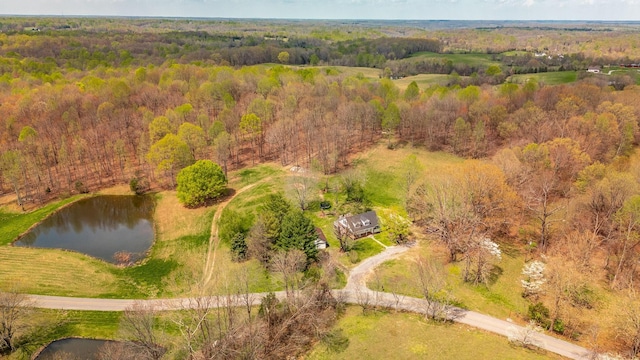 bird's eye view with a water view and a forest view