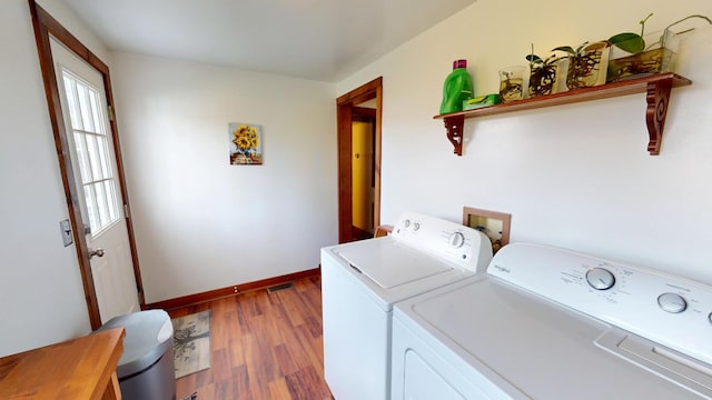 2519 Old Greenbrier Pike, Greenbrier, TN 37073 - washroom with baseboards, washer and clothes dryer, laundry area, and wood finished floors