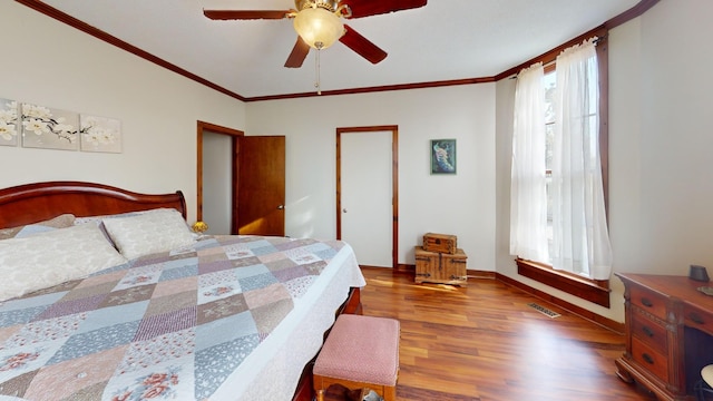 2519 Old Greenbrier Pike, Greenbrier, TN 37073 - bedroom featuring visible vents, ornamental molding, a ceiling fan, and wood finished floors