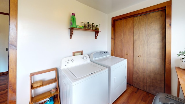 2519 Old Greenbrier Pike, Greenbrier, TN 37073 - laundry room with wood finished floors, washer and dryer, and laundry area