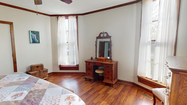 2519 Old Greenbrier Pike, Greenbrier, TN 37073 - bedroom with wood finished floors, multiple windows, and ornamental molding
