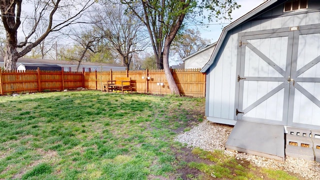 2519 Old Greenbrier Pike, Greenbrier, TN 37073 - view of yard with a storage shed, a fenced backyard, and an outdoor structure
