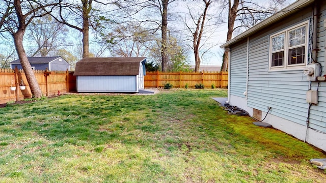 2519 Old Greenbrier Pike, Greenbrier, TN 37073 - view of yard featuring an outdoor structure, a storage shed, and a fenced backyard