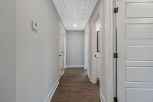 hall featuring baseboards, recessed lighting, attic access, and dark wood-style floors