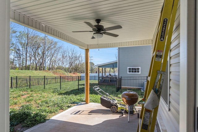 view of patio with fence and a ceiling fan