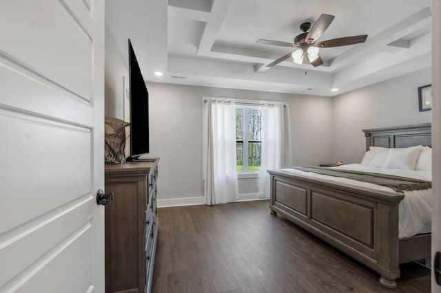 bedroom featuring a tray ceiling, a ceiling fan, recessed lighting, dark wood-style flooring, and baseboards