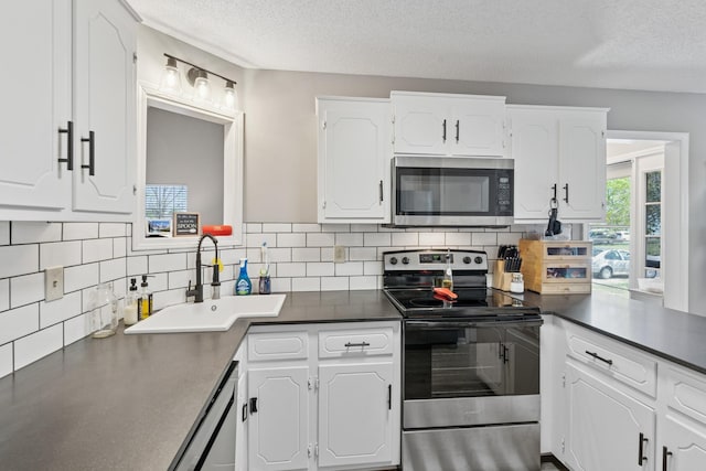 238 Kathleen Ct, Clarksville, TN 37043 - kitchen with a sink, white cabinets, appliances with stainless steel finishes, and a textured ceiling