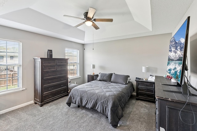 238 Kathleen Ct, Clarksville, TN 37043 - carpeted bedroom with a tray ceiling, baseboards, and ceiling fan