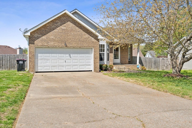 238 Kathleen Ct, Clarksville, TN 37043 - view of front of property featuring a front yard, a garage, fence, concrete driveway, and brick siding