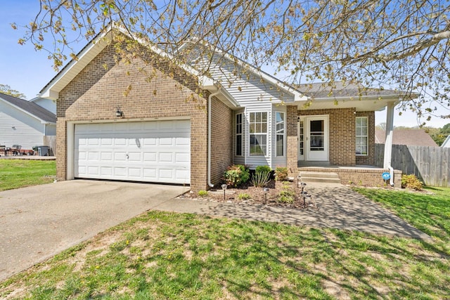 238 Kathleen Ct, Clarksville, TN 37043 - view of front of property with an attached garage, concrete driveway, fence, and brick siding