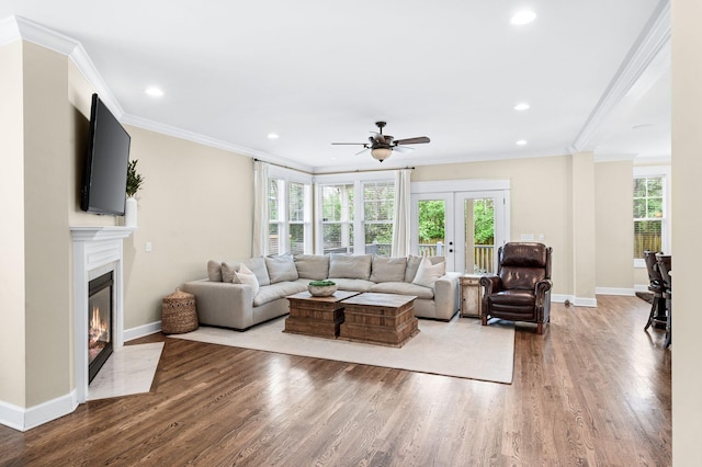15 Westlawn Ct, Nashville, TN 37209 - living room with ceiling fan, a fireplace with flush hearth, ornamental molding, wood finished floors, and baseboards
