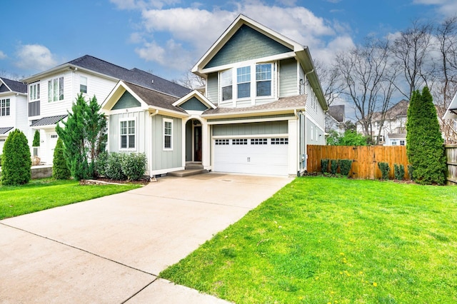 15 Westlawn Ct, Nashville, TN 37209 - view of front of home with concrete driveway, board and batten siding, a front lawn, a garage, and fence