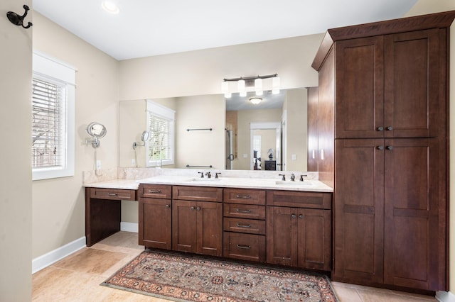 15 Westlawn Ct, Nashville, TN 37209 - full bath featuring tile patterned flooring, double vanity, baseboards, and a sink