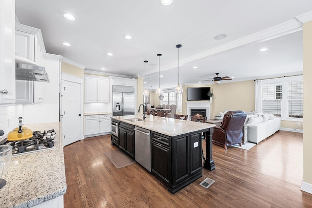 15 Westlawn Ct, Nashville, TN 37209 - kitchen featuring stainless steel appliances, a sink, dark cabinetry, and a healthy amount of sunlight