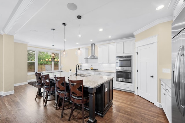 15 Westlawn Ct, Nashville, TN 37209 - kitchen with ornamental molding, backsplash, wall chimney exhaust hood, stainless steel appliances, and a sink