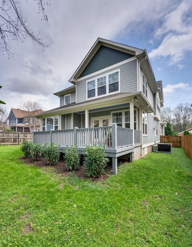 15 Westlawn Ct, Nashville, TN 37209 - back of property featuring a porch, fence, and a lawn