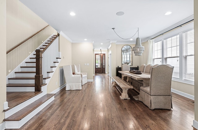 15 Westlawn Ct, Nashville, TN 37209 - dining space with crown molding, stairway, dark wood-style flooring, a notable chandelier, and baseboards