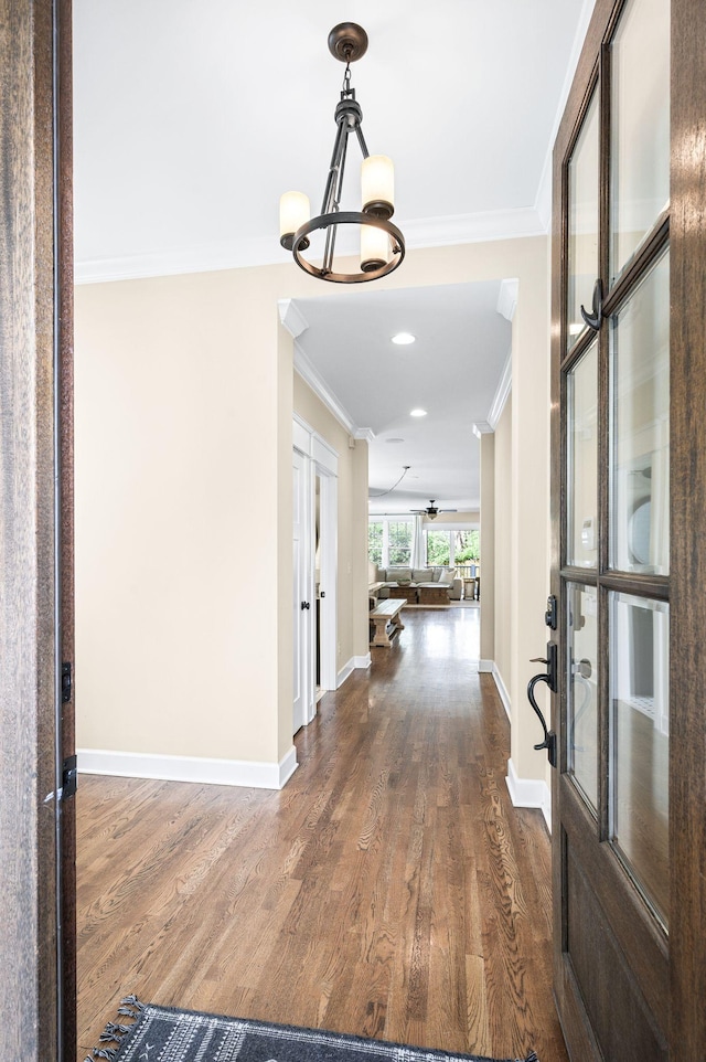 15 Westlawn Ct, Nashville, TN 37209 - entrance foyer featuring baseboards, an inviting chandelier, dark wood-style floors, crown molding, and french doors