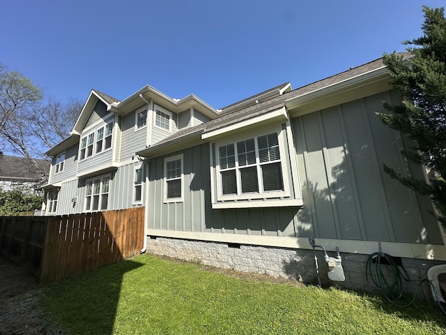 15 Westlawn Ct, Nashville, TN 37209 - view of side of home with crawl space, board and batten siding, fence, and a yard