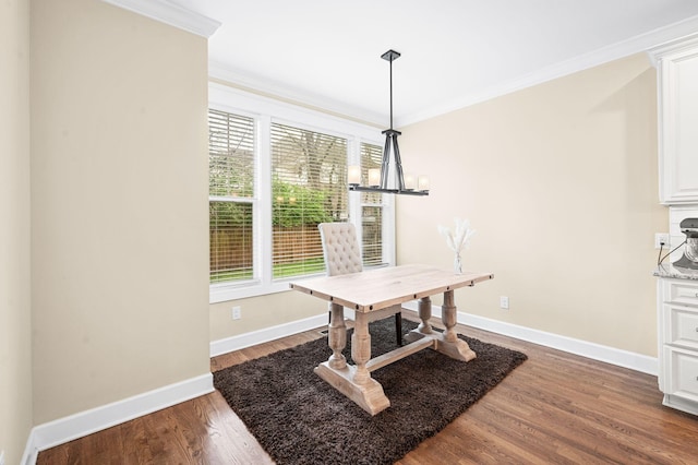 15 Westlawn Ct, Nashville, TN 37209 - dining area featuring crown molding, baseboards, a notable chandelier, and wood finished floors