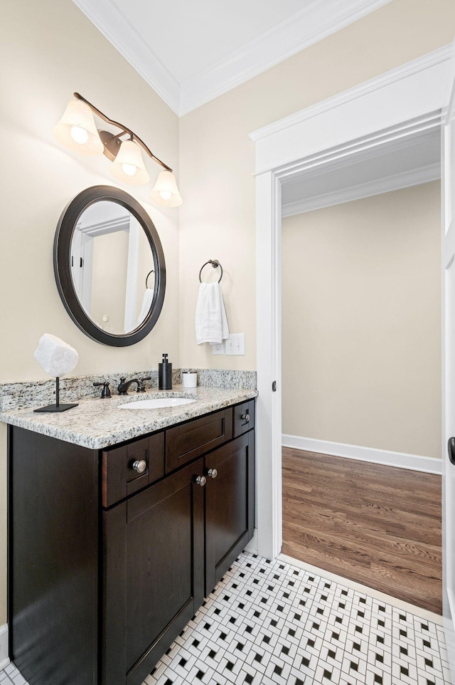15 Westlawn Ct, Nashville, TN 37209 - bathroom featuring vanity, baseboards, ornamental molding, and wood finished floors