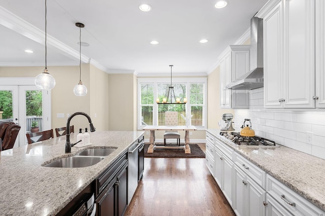 15 Westlawn Ct, Nashville, TN 37209 - kitchen with appliances with stainless steel finishes, a sink, wall chimney exhaust hood, and a wealth of natural light