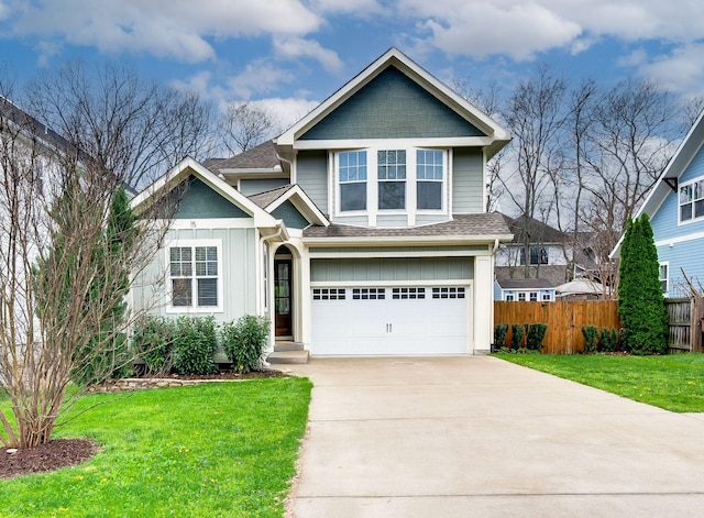 15 Westlawn Ct, Nashville, TN 37209 - view of front of home with a front lawn, fence, driveway, and roof with shingles