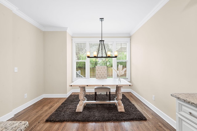 15 Westlawn Ct, Nashville, TN 37209 - dining area with dark wood-type flooring, ornamental molding, baseboards, and a chandelier